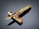 An elegant fountain pen crafted from Exotic Wenge Wood with Red Gold detailing, featuring custom hardware with a rampant lion design, lying on a black surface with a reflective background.