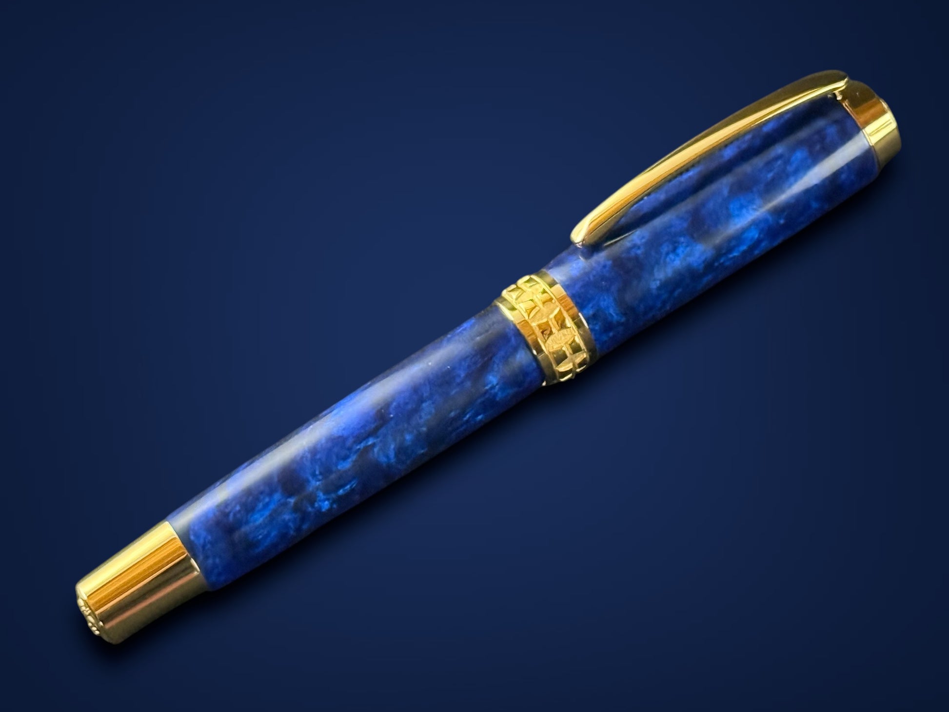 “Handcrafted Deep Sapphire pen with gold trim, artisan writing instrument”
