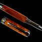 Exotic Amboyna Wood Handmade Black Titanium Rollerball Pen. One of a Kind, Handcrafted by Highlander Pen in CO. Ink, Sleeve, & Box Included. [ML-RB-1120-02]