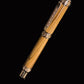 Luxury pen with gold and silver accents on a black background