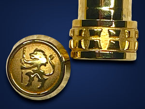 Gold cap with a rampant Lion engraved on the finial on a blue background.