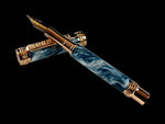 An elegant red and gold fountain pen with intricate engravings and a cap finial depicting a lion.